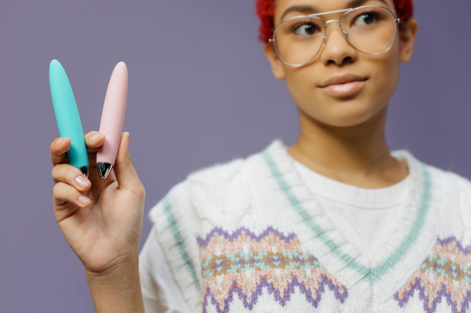 Close-up of hands holding a sleek lemon vibrator, symbolizing reconnection with touch.