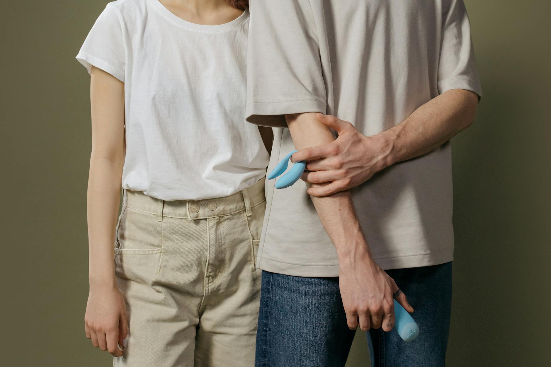 A couple standing together indoors, showing modern approaches to intimacy and pleasure without pressure