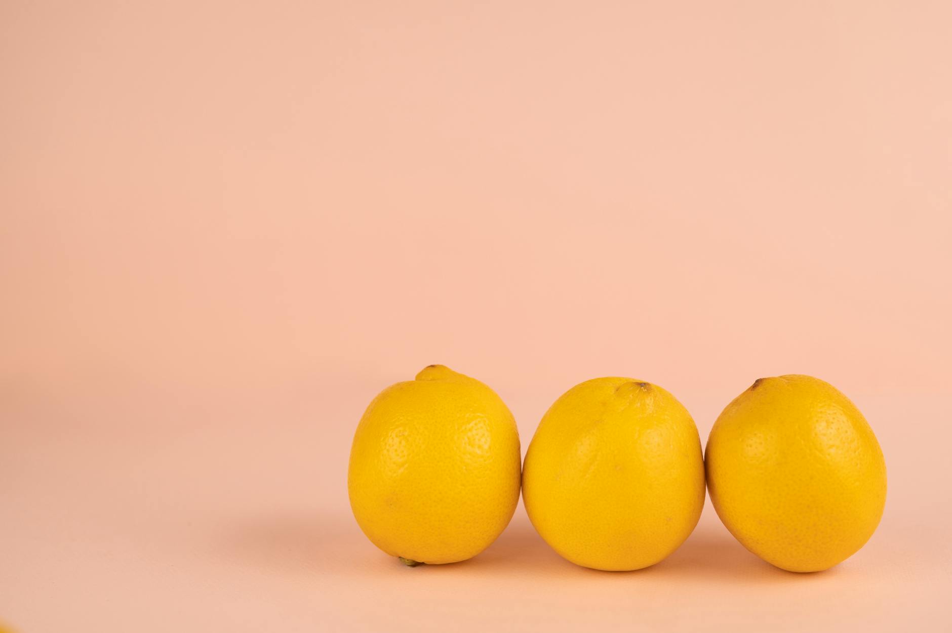 Bright ripe lemons with fresh appeal on a pastel background